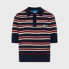 Kortærmet strik polo fra BALL med horisontale striber i navy, hvid og bordeaux, polokrave og broderet logo. Lavet af nylon, polyester, akryl og genanvendt uld.