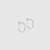Organic Arena Small Hoops fra ENAMEL Copenhagen er små, elegante hoops i sterlingsølv med organisk, hamret overflade. Et tidløst og diskret smykke, perfekt til hverdagsbrug og minimalistisk styling. Find Organic Arena Hoops hos Merci Give.