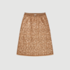 Ninia Skirt fra MUNTHE er en elegant nederdel i Old Brass med transparente pailletdetaljer og elastisk talje. En festlig og stilfuld nederdel, der nemt kan styles både til hverdag og aften. Find MUNTHE Ninia Skirt hos Merci Give.