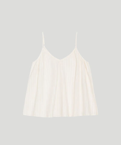 Sunshine Top Dobby fra moshi moshi mind er en feminin stroptop i 100 % økologisk bomuld med V‑udskæring, justerbare stropper og dekorativt dobby‑broderi. En let og elegant top, perfekt til sommerens garderobe. Find Sunshine Top hos Merci Give.