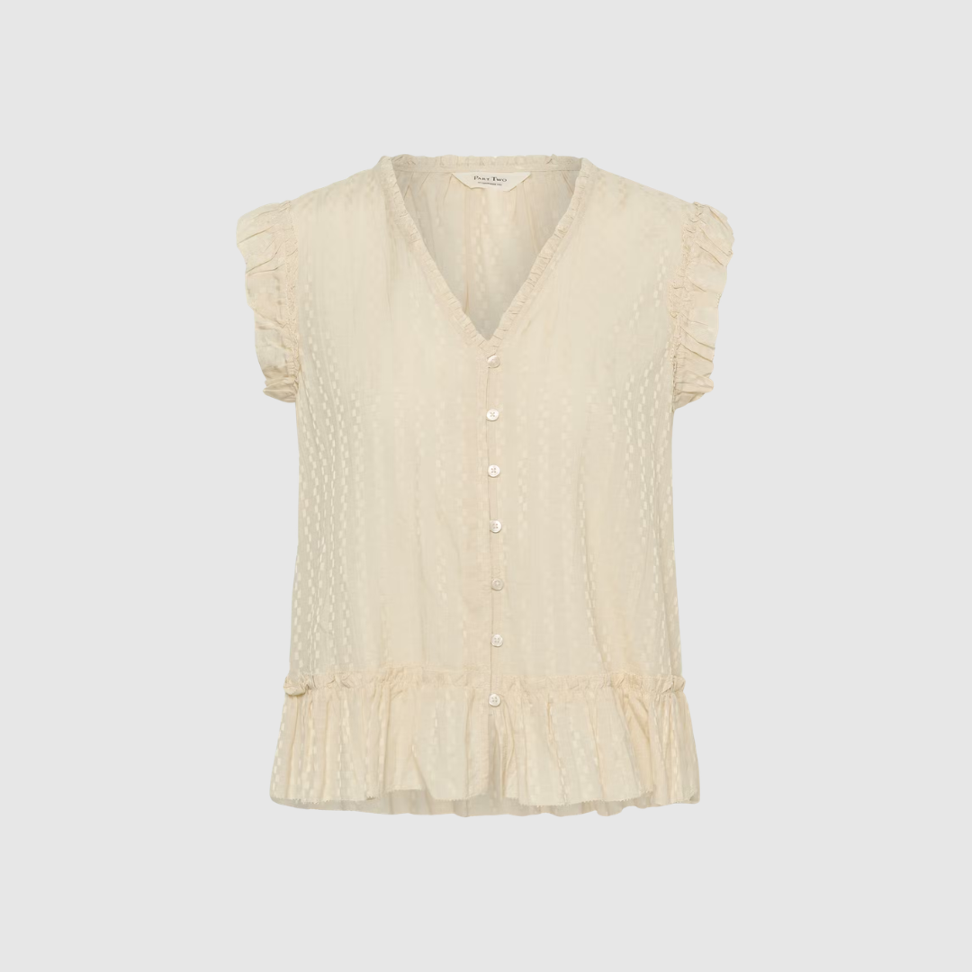 Part Two AnekaPW Top er en feminin og let ærmeløs top i bomulds‑ og viskoseblanding. Designet med V‑udskæring, knaplukning og flæsedetaljer i en smuk oatmeal‑farve. Perfekt til både hverdag og arbejde. Find AnekaPW Top hos Merci Give.