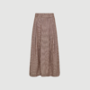 JihoCC Anya Pleat Skirt fra Co’Couture i brun er en elegant nederdel med læg og flot fald. Perfekt til både hverdag og pænere brug med sit feminine og stilrene design.