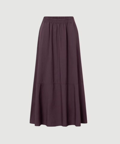 PETULA GMTD Poplin Midi Skirt fra Rue de Tokyo er en feminin midi nederdel i 100 % økologisk bomuld. Nederdelen har A‑form, elastisk talje og let poplin‑kvalitet, hvilket gør den perfekt til både hverdag og mere elegante looks.